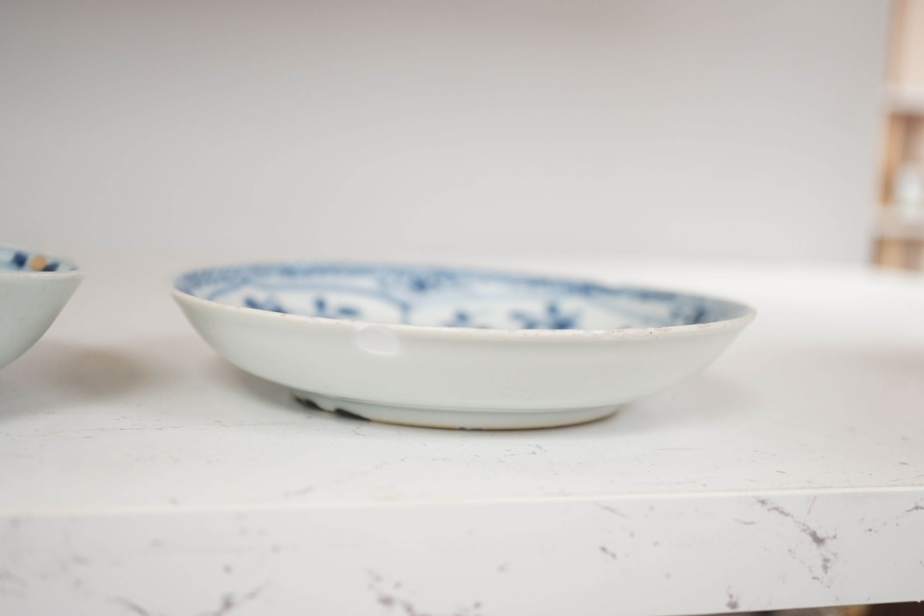 An 18th century Chinese Imari saucer, another blue and white saucer and sang de boeuf brush washer. Tallest 10cm